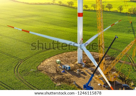 wind turbine erecting sunrise Royalty-Free Stock Photo #1246115878
