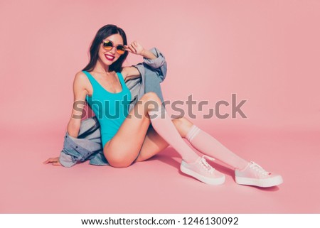 Full size attractive pretty fun joy nice cute alluring lady with her perfect modern hairdo she sit on floor isolated on shine pastel pink background in spectacles style denim jeans shirt clothes