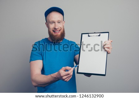 Portrait of nice lovely handsome attractive cheerful cheery glad bearded deliver in blue uniform holding in hands showing paper document to sign isolated over gray pastel background