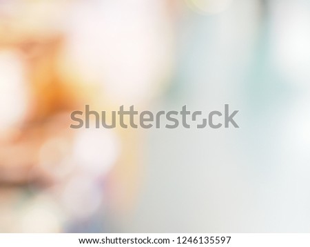 Abstract Blurred Defocused Bokeh Background Of Bright Colorful Light fade to white on the right corner