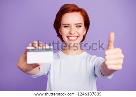 Close up portrait of beautiful pretty cheer she her girl with finger up recommending pay pass creditcard for daily comfortable safety using isolated on violet background
