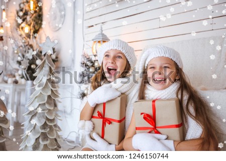 Happy kids with gifts in shocker Christmas background