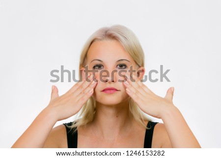 Face exercise cheekbone push up, woman press against face gently using the palms of hands