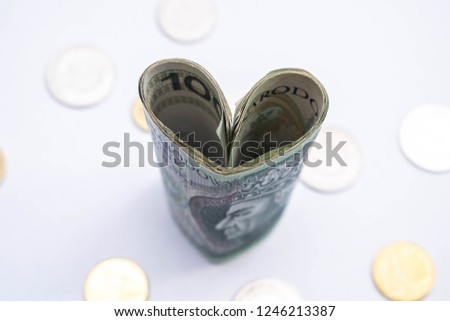 "Loving money" concept. Heart made of few polish zloty (PLN) papers. Valentine's day expenses.