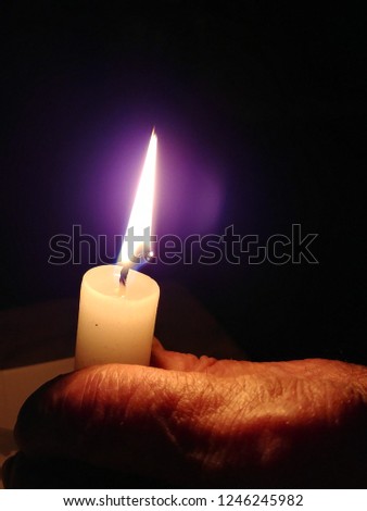 candle and old hand