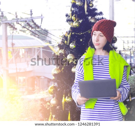 tourist cute girl send message for celebrate christmas day to family
