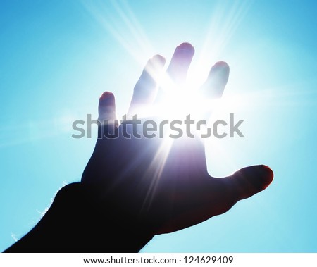 Hand to sun. Element of design. Royalty-Free Stock Photo #124629409