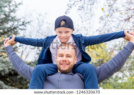 Father and his son spending time together in a park