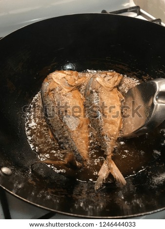 Thai traditional food; fried Mackerels fish in vegetable oil.