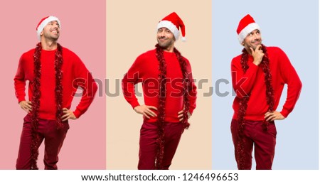 Set of Man with red clothes celebrating the Christmas holidays posing with arms at hip and laughing