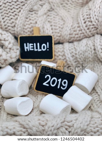 2019 marshmallows with chalkboards on cute shabby knit background