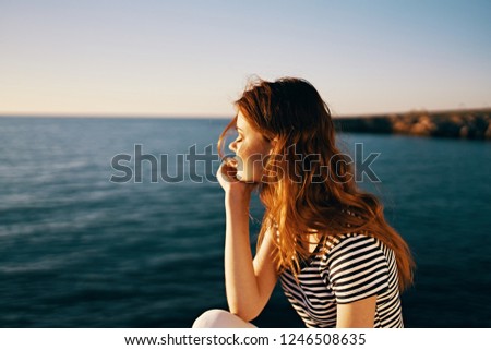 A woman on summer vacation admiring nature                     