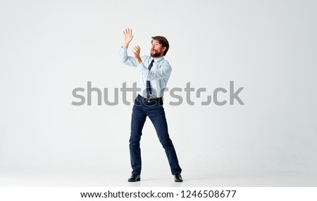 Business man raises his hands up                     