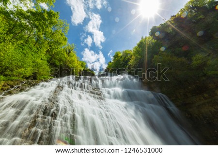 river in the Jura mountain with a sunbeam lay , Eventail water fall, France.