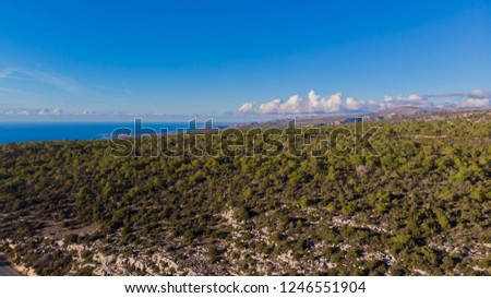 Aerial photo of Paphos, Cyprus, showing the city, hills, sea, forest and neighborhood in Peyia  