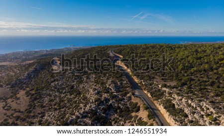 Aerial photo of Paphos, Cyprus, showing the city, hills, sea, forest and neighborhood in Peyia  