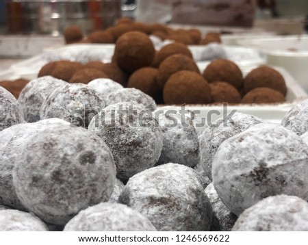 Close up picture from chocolate balls praline chocolate candy wirh background blurr