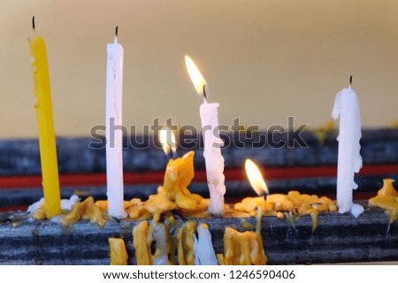 Candles used in worship and blessings according to Buddhist beliefs in temples.