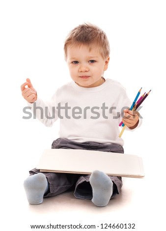Boy drawing with a pencil
