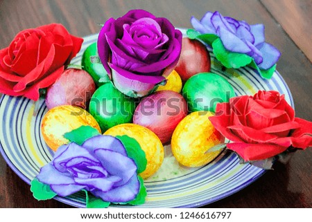 pictured in the photo lots of beautiful colorful Easter eggs on a plate