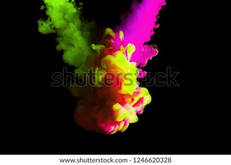 paint stream in water, colored ink cloud, abstract background, process of mixing multicolored dye on a black background