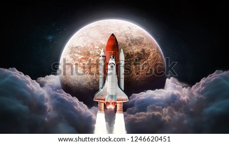 Space shuttle and Red planet in the space. Clouds on background. Mars. Elements of this image furnished by NASA