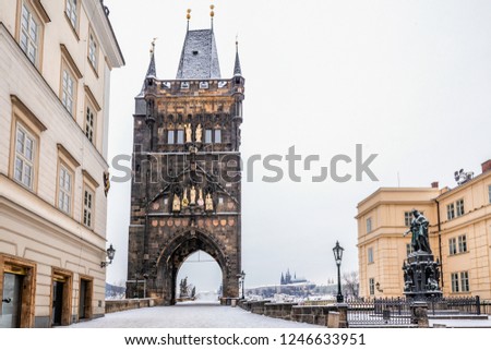 Charles bridge in winter morning at Prague Czech Republic. This bridge is the oldest in the city and a very popular tourist attraction.