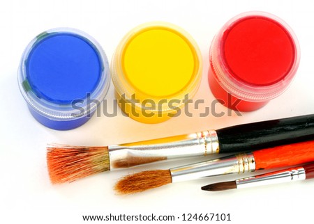 multicolor children paints with different paintbrushes