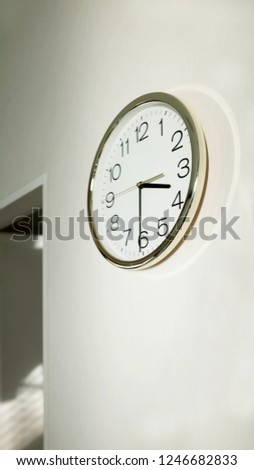 modern stainless round  frame clock on white wall