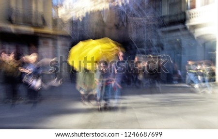 Tribute to Ernst Hass, Tribute to Monet, ghostly human figures in Plaza Zocodover of Toledo, Spain, tour guides with yellow umbrellas, photographic sweep,  blurred people, impressionist photography, 