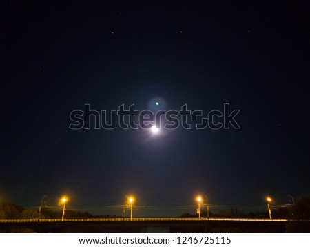 Night bridge and the Moon. Long exposure mobile photo