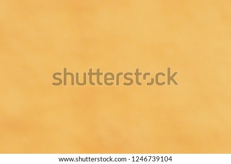 Blurred focus of light orange and yellow warm tone for art and abstract glossy background