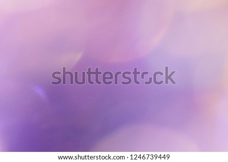 Blurred focus of beautiful bokeh lights in pink and purple tone for bright and glossy background. Seasons greetings, Merry Christmas and Happy New Year celebrations concept