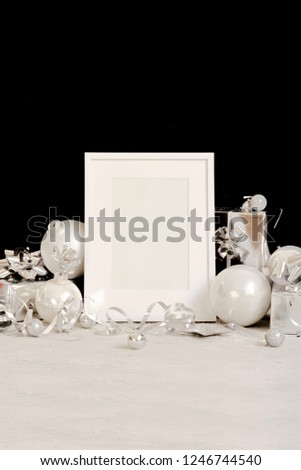Mock up frame on dark background with Christmas decorations baubles, gift boxes and snow Invitation, card. Copy spase Trendy black ans white minimal concept