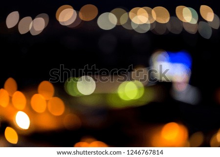 Abstract background of lights in circle of defocused colors