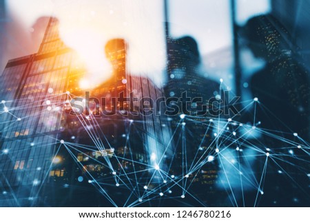 Silhouette of business people work together in office. Concept of teamwork and partnership. double exposure with network effects Royalty-Free Stock Photo #1246780216