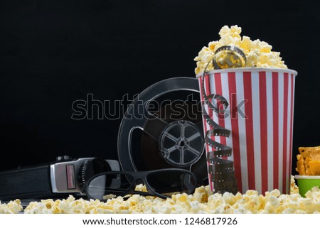 paper cups and film from an old video camera on popcorn