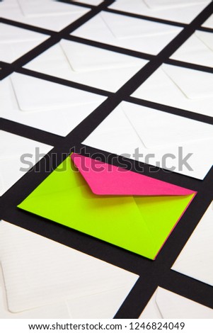 Composition with white and two-color envelopes on the table. The photo suitable for various holidays and anniversaries.