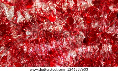 Colorful Christmas tinsel. New year's fluffy gold tinsel, tinsel, and pink tinsel. Sparkling ornament decoration concept.
