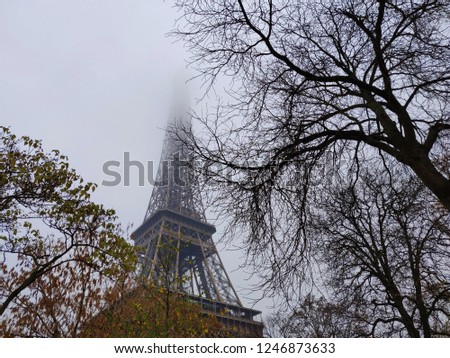 A view of the Eiffel Tower in Paris on a misty day when the needle is lost in the mist! 