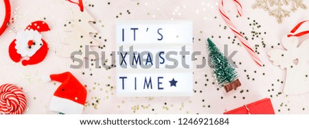 New Year or Christmas decoration flat lay top view Xmas holiday celebration handmade gift boxes on pink concrete background. Template mockup for greeting card or your text design