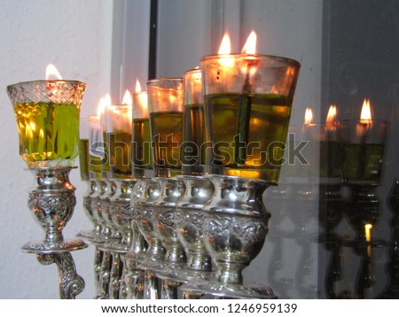 Hanukkah lamp lit at night during Hanukkah