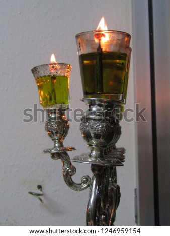 Hanukkah lamp lit at night during Hanukkah