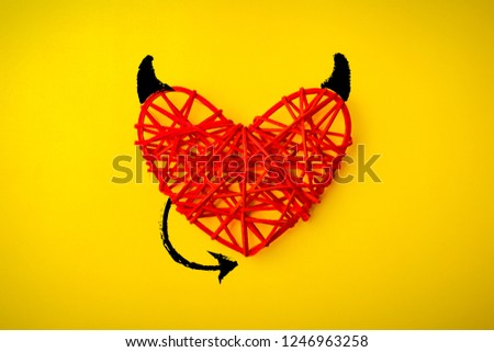 Red heart with a horn and tail of the devil Theme for Valentine Day. Wedding, love