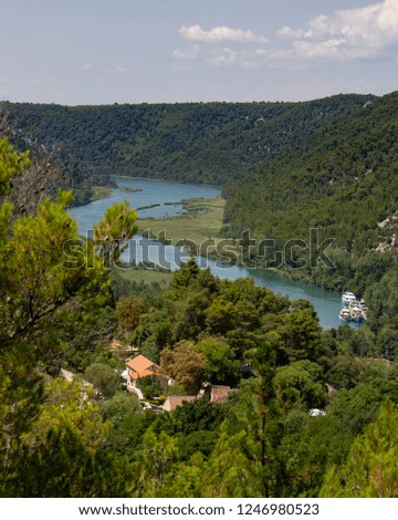 Boats are docked on the Krka River in the Krka National Park in Croatia
