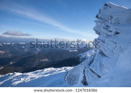 Majestic winter landscape. Dramatic wintry scene. Location Carpathian national park, Ukraine, Europe. Rocks and blue sky