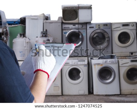 Women work in recycling garbage plant electronics Washing machine waste old, used and obsolete electronic equipment for  recycle in factory industry.
 Royalty-Free Stock Photo #1247074525