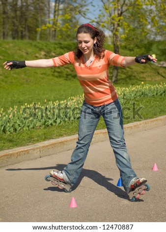 Rollerskating Girl Outdoors on Green Background