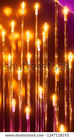 blurred defocused gold bright light. lens flare. shiny spots. dark background. Festive celebration blurry background. copy space. holiday background