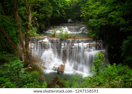 Huay mae khamin waterfall, this cascade is emerald green and popular in Kanchanaburi province, Thailand.